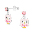 Owl sterling silver ear studs with crystal epoxy on a white background