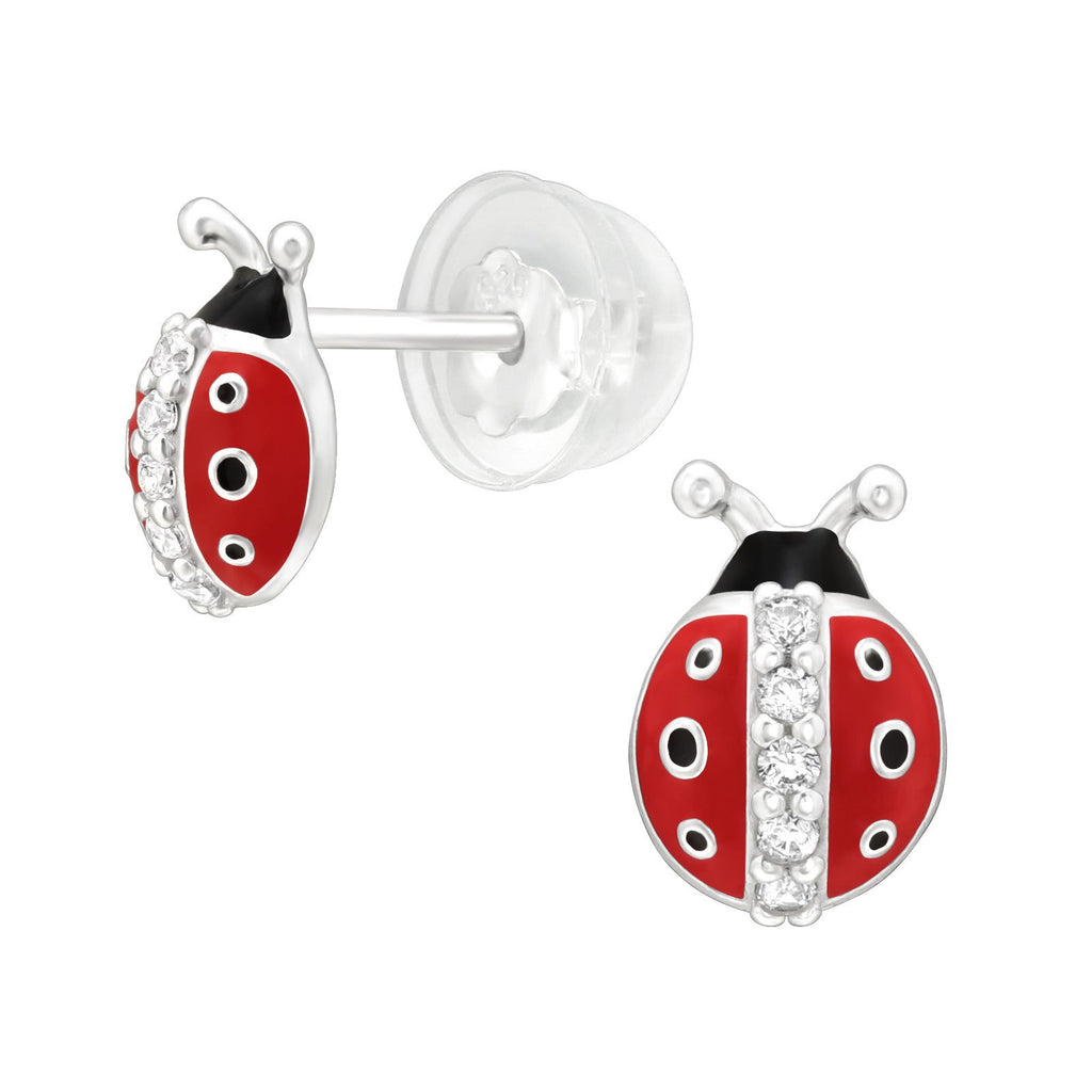Ladybug-shaped earrings with red, black, and white design on a white background.