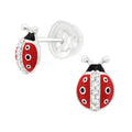 Ladybug-shaped earrings with red, black, and white design on a white background.