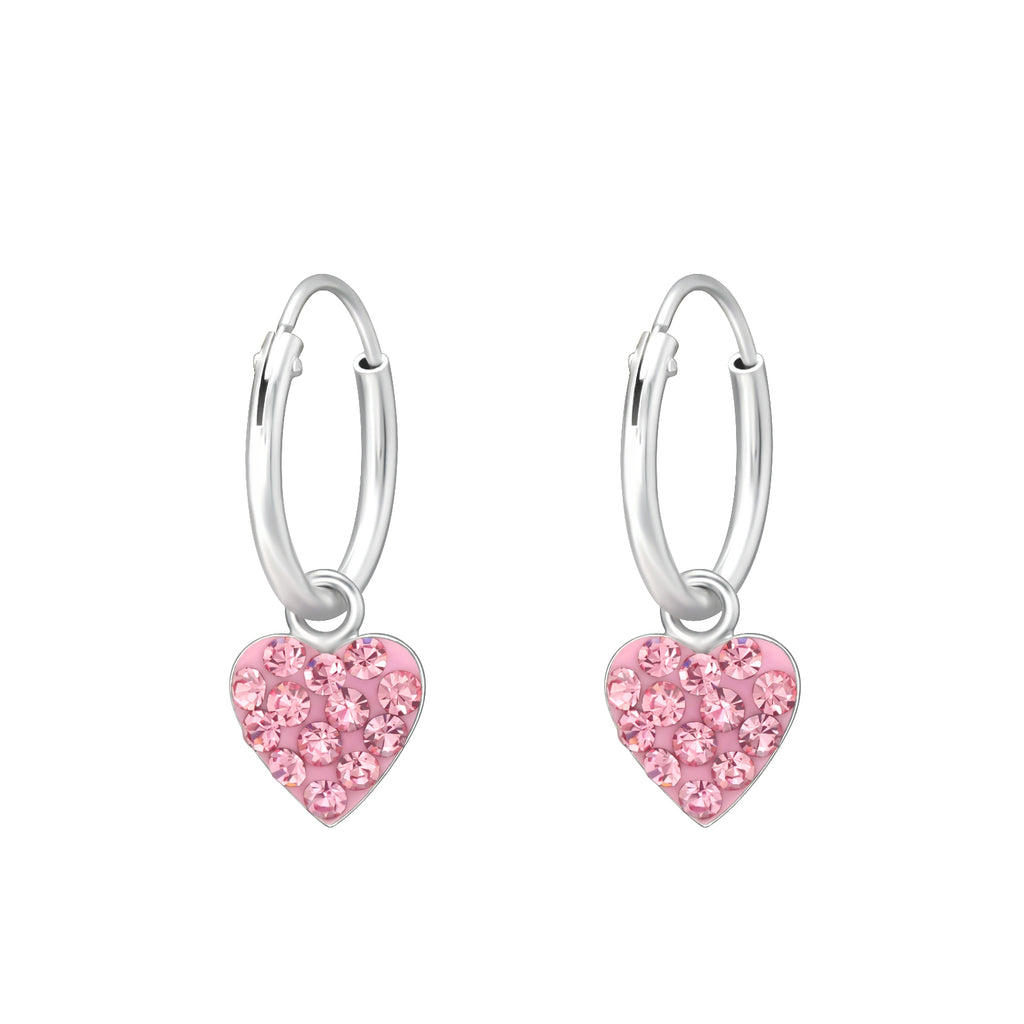 Heart crystal sterling silver children’s ear hoops on a white background