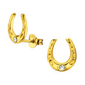 Horseshoe gold ear studs with crystal on a white background