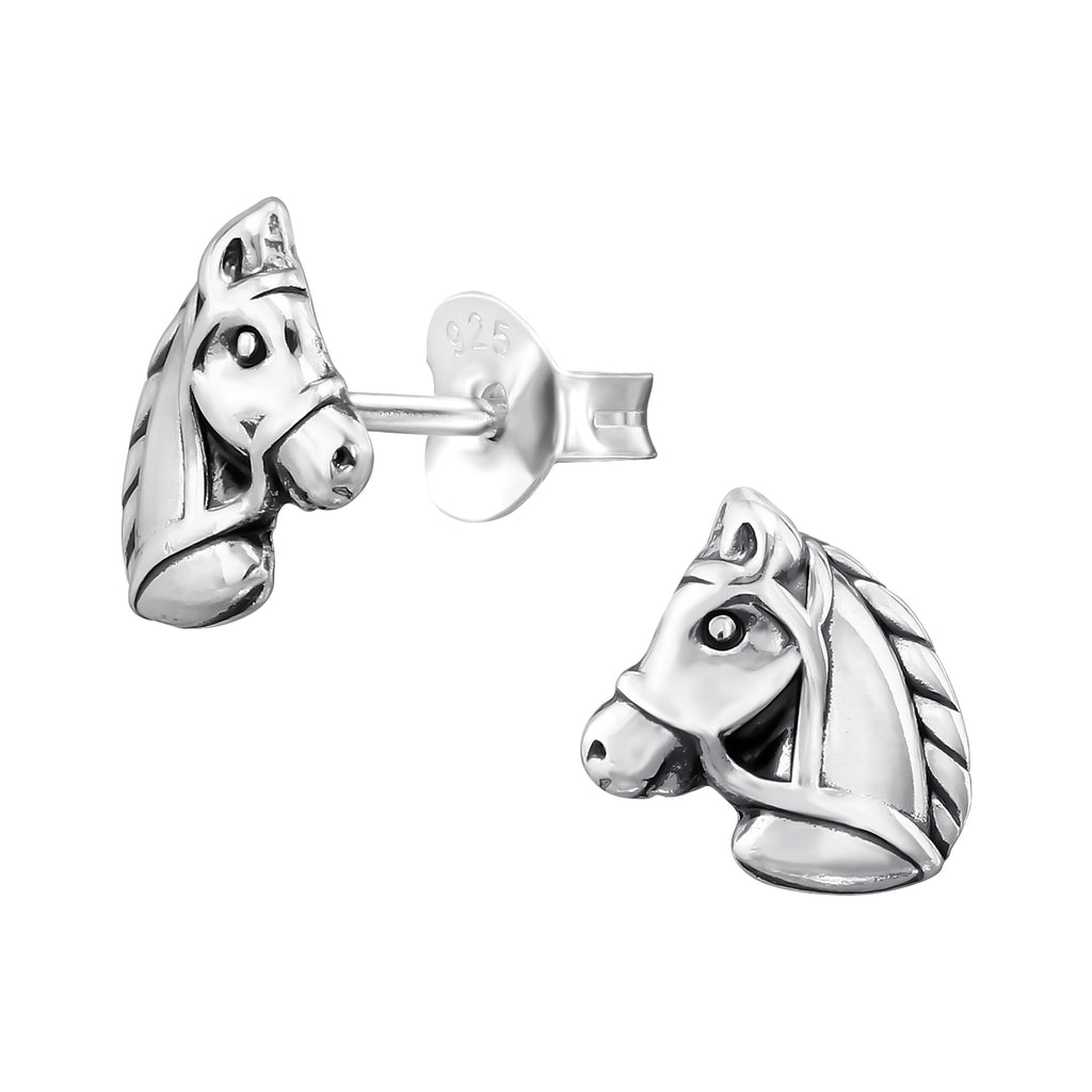 Horse oxidised sterling silver ear studs on a white background.