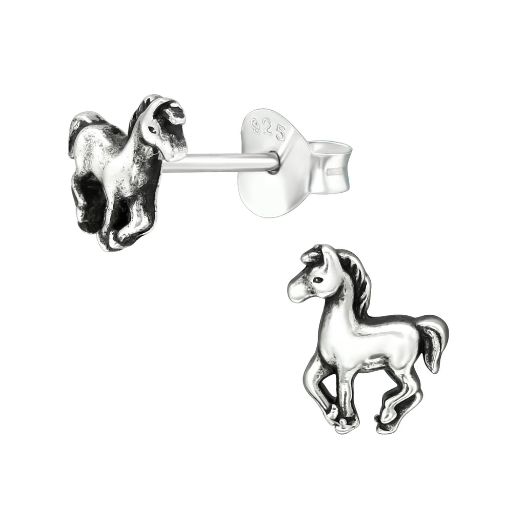 Horse sterling silver ear studs on a white background
